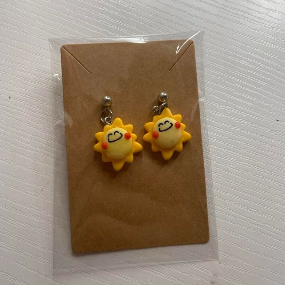 sun earrings with smiling face